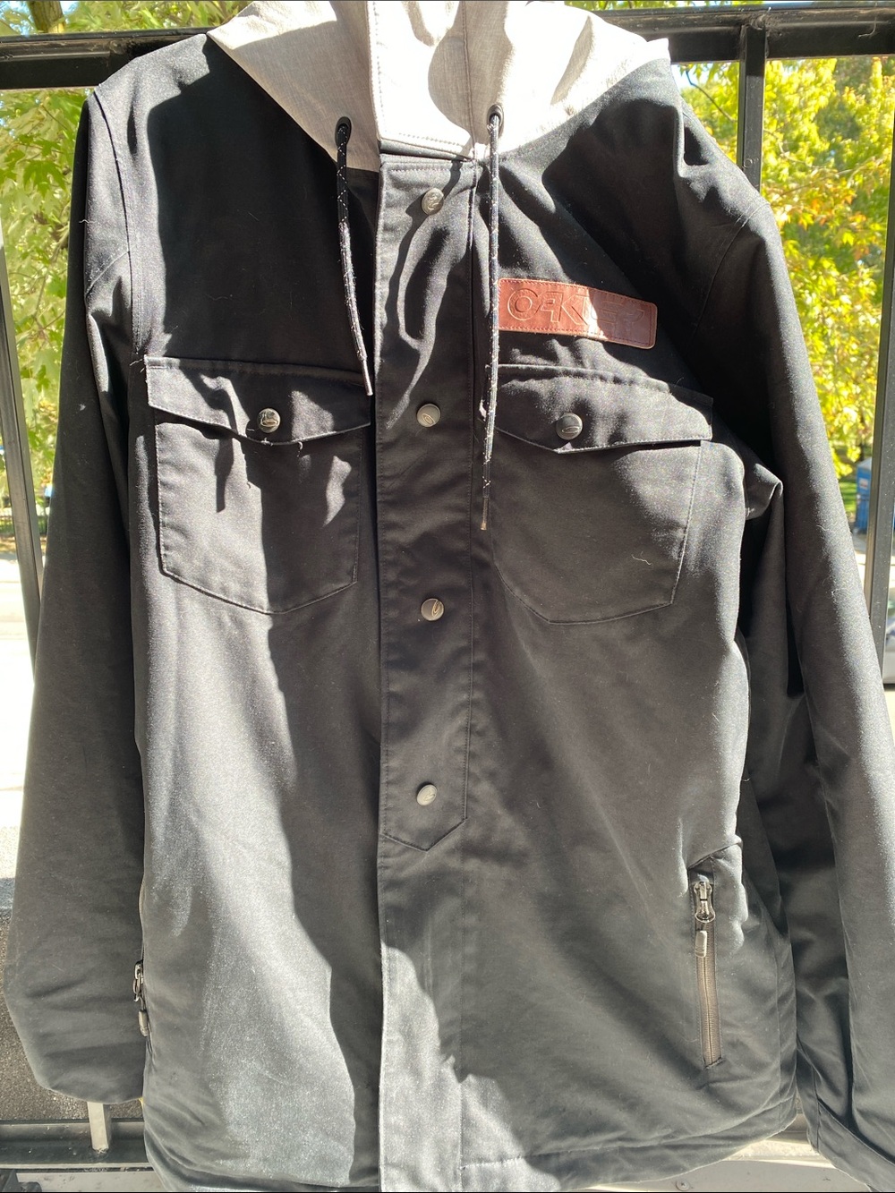 Oakley Black Jacket with Light Gray Hood and Brown Chest Patch